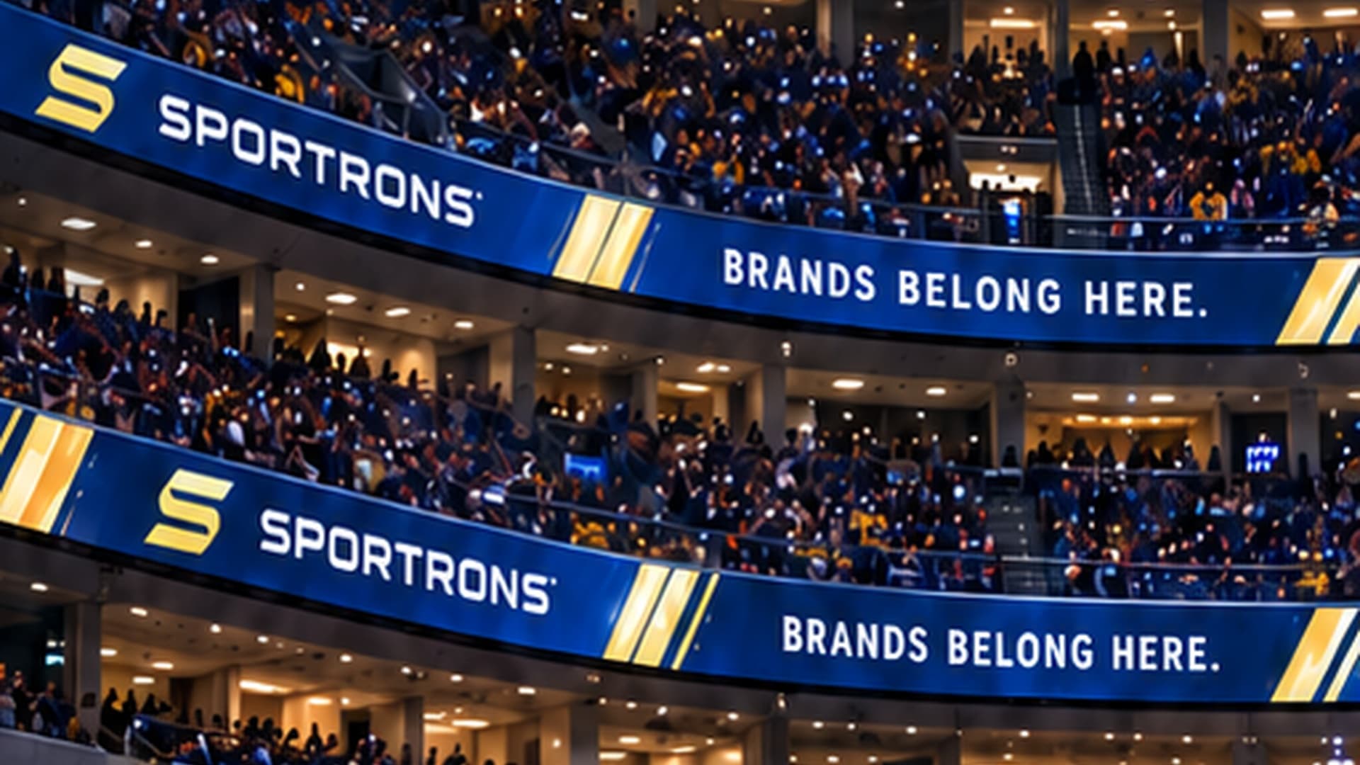 LED ribbon board advertising wrapping the seating levels of a stadium above the crowd